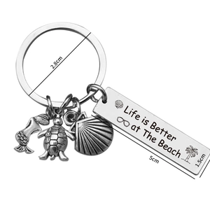 Stainless steel beach keychain with mermaid turtle shell charms and life is better quote