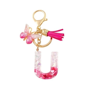Pink resin letter U keychain with gold lobster clasp, butterfly and tassel pendant