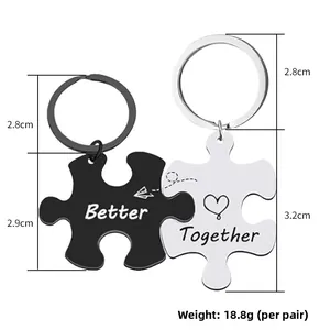 Better Together heart and plane puzzle keychain set in black and silver stainless steel
