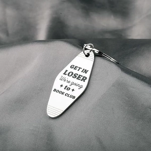 Polished stainless steel shuttle keychain with Get In Loser We're Going to Book Club text