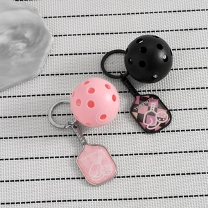 Pickleball sports keychain set in black and pink with paddle and ball charms