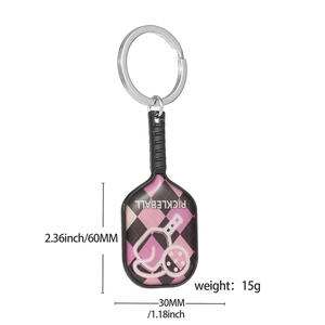 Pink and black pickleball paddle keychain made of zinc alloy with 60mm dimensions