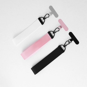 Trio of braided phone lanyards in white, pink, and black with metal lobster clips