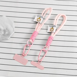 Pink braided phone lanyard set with metal carabiner and secure attachment patch