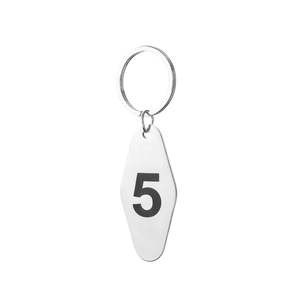 Detail view of a silver diamond-shaped stainless steel keychain with number 5 print