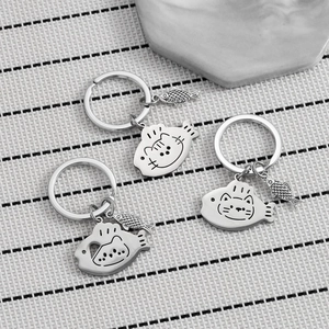Set of three cute stainless steel cat and fish keychains with heart cutouts in silver finish
