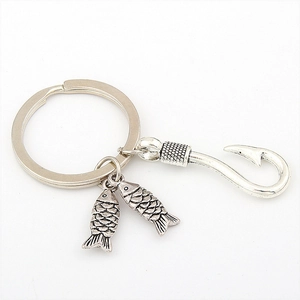 Fishing keychain with metal hook and two detailed fish charms in vintage silver finish