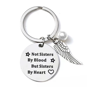 Sister keychain with engraved heart quote, angel wing charm and white pearl accessory