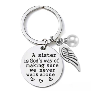 Sister stainless steel keychain with wing pendant and pearl featuring engraved quote