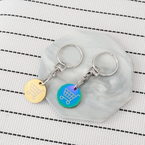 Polished stainless steel trolley token keychains in gold and iridescent rainbow finish