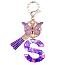 Porte-clés lettre S en résine avec pierres violettes, papillon doré et gland décoratif