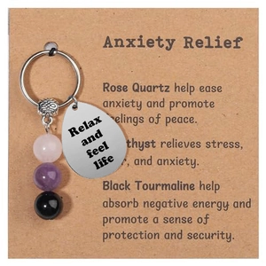 Detail of natural gemstone beads and engraved stainless steel tag on card packaging