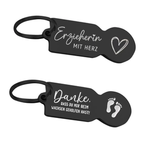 Matte black stainless steel trolley token keychain with personalized German engravings