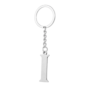 Detailed macro view of silver stainless steel letter I keychain with a polished finish