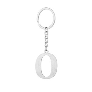 Close-up of silver metal letter O keychain with brushed texture on white background