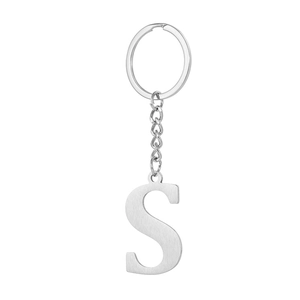 Macro shot of brushed stainless steel letter S keychain with durable flat round key ring