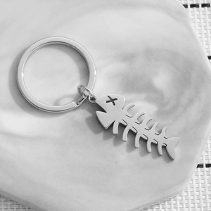 Polished stainless steel fish bone keychain with a minimalist cat-inspired design