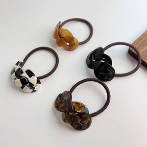 Set of 4 vintage acetate twist hair ties in checkered and amber patterns for women