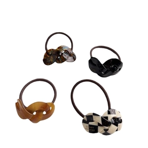 Set of 4 acetate twisted chain hair ties in tortoiseshell, amber and checkered patterns