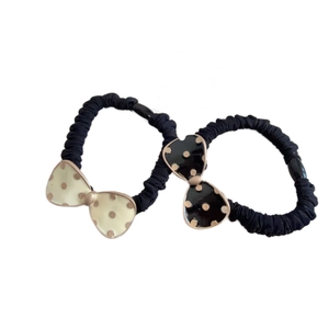 Set of two polka dot bow hair ties with pleated black fabric and enamel charms