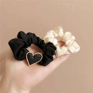 Chic matte satin hair scrunchies with metallic heart charms in black and white set