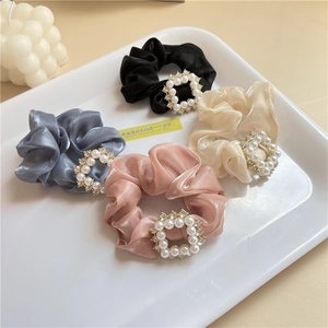 Detail of satin scrunchie set with elegant pearl and rhinestone square buckles in four colors