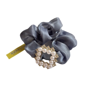 Elegant grey satin scrunchie with pearl rhinestone detail and inspirational tag
