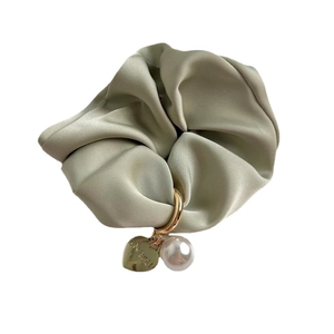Elegant satin scrunchie in sage green with pearl and engraved heart gold pendant