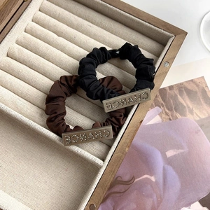 Elegant rhinestone letter hair ties set in black and brown with gold metal chance buckle