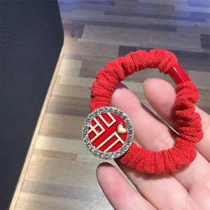 Festive red scrunchie with sparkling rhinestones and Chinese Fu character for Lunar New Year