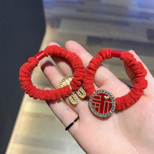 Red ruffled hair scrunchies set with Fu character charm and lock pendant for Lunar New Year