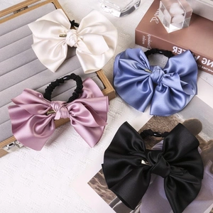 Elegant satin bow hair ties set in cream, pink, blue and black with gold metal charms