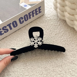 Elegant black flocked hair claw with silver rhinestone snowflake for winter hairstyles
