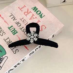 Elegant black flocked hair claw clip featuring a silver rhinestone snowflake design