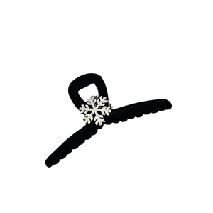 Winter black flocked hair claw clip with a sparkling rhinestone snowflake decoration