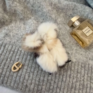 Square plush hair claw clips in fuzzy cream and grey faux fur with gold accents