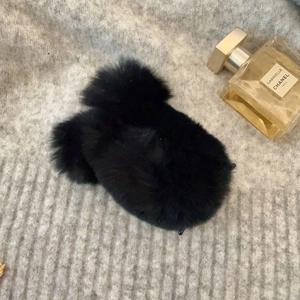 Detail of soft black plush square hair claw clip with a fuzzy texture for women