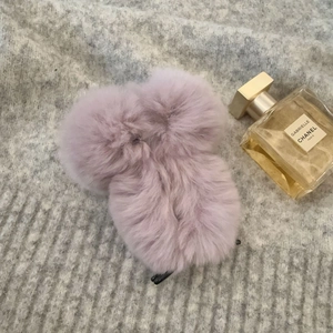 Close-up of lavender faux fur square hair claw clip with fluffy dual ball texture detail