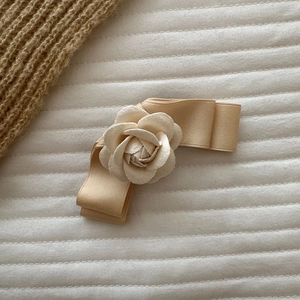 French style camellia bow hair clip in cream fabric for women elegant hairstyle