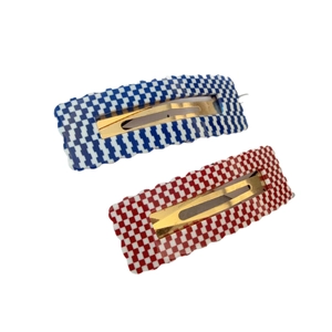 Checkerboard pattern rectangular acetate hair clips set in blue and red wavy edge design