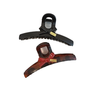 Eleganti mollette per capelli con fiocco nero e tartarugato con placca in metallo dorato