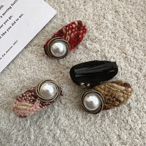 Vintage tweed hair clips with faux pearl buttons in red, pink and brown tones