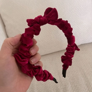 Padded wine red velvet pleated headband with bow detail, stylish hair accessory for women