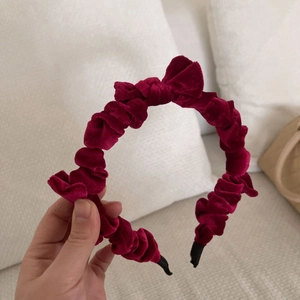 Elegant deep red velvet pleated headband with a thick vintage padded design for women