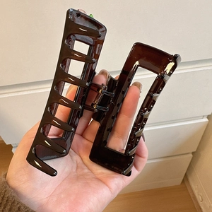 Minimalist large amber resin hair claw clip in rectangular design for thick hair styling