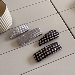 Chic checkered woven hair clips in silver and black colors with a metallic satin finish