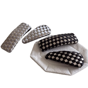 Checkerboard weave hair clip set with black and silver rectangular and drop-shaped designs