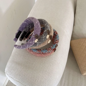 Vintage knitted headband set with decorative buttons and handmade labels in multiple colors