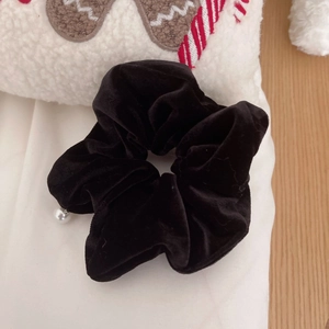 Elegant black velvet scrunchie with a white faux pearl pendant for hair styling