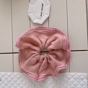Plush pink mink fur knit scrunchie with delicate crochet lace trim for winter styling